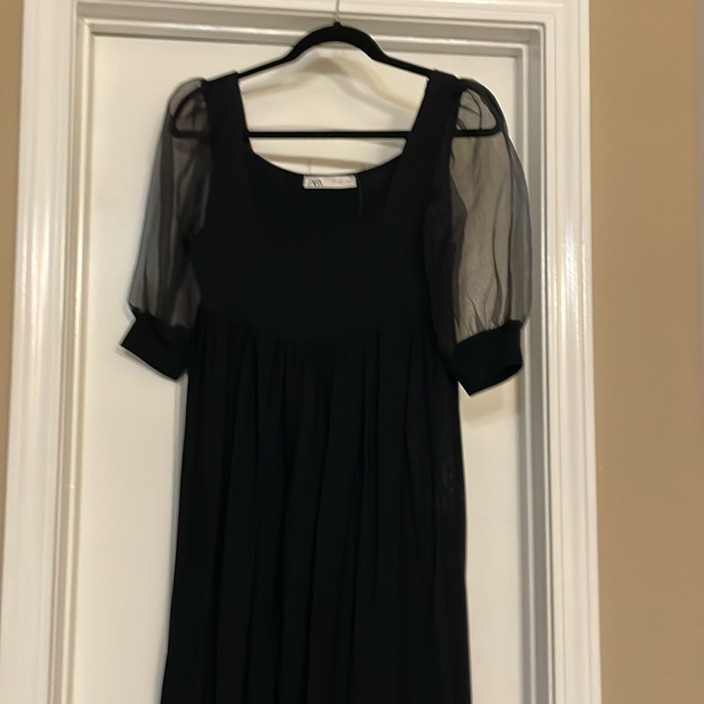 Black maxi dress with sheer sleeves,
